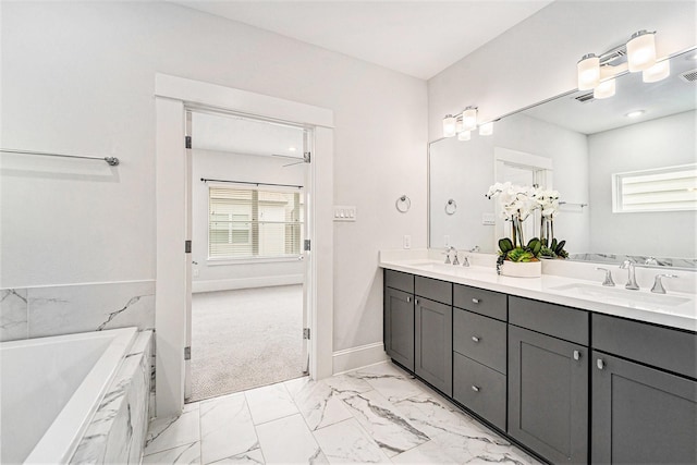 1266 N Post Oak Rd Unit B, Houston, TX 77055 - bathroom featuring double vanity, marble finish flooring, and a tub with marble appearance