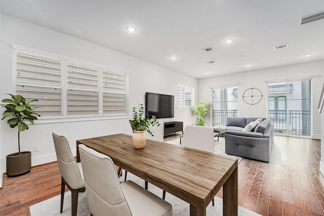 1266 N Post Oak Rd Unit B, Houston, TX 77055 - dining area featuring light wood finished floors and recessed lighting