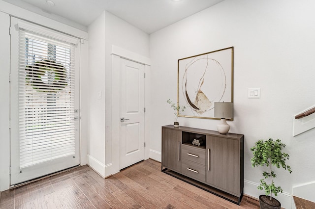 1266 N Post Oak Rd Unit B, Houston, TX 77055 - foyer entrance with light wood-type flooring and baseboards