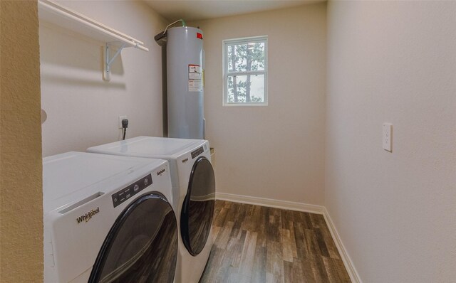 940 Cedar Point Dr, Livingston, TX 77351 - laundry room featuring electric water heater, independent washer and dryer, dark wood-style floors, and baseboards