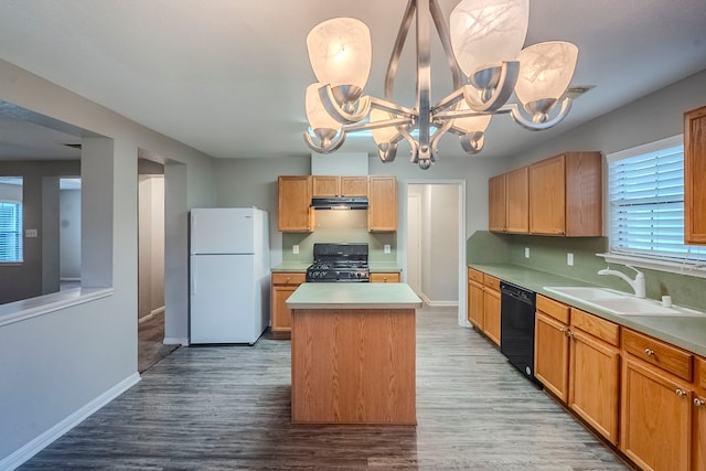21106 Scenic Bluff Ln, Humble, TX 77338 - kitchen with freestanding refrigerator, range with gas cooktop, dishwasher, a sink, and under cabinet range hood