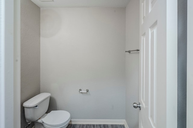21106 Scenic Bluff Ln, Humble, TX 77338 - bathroom featuring toilet, baseboards, and wood finished floors