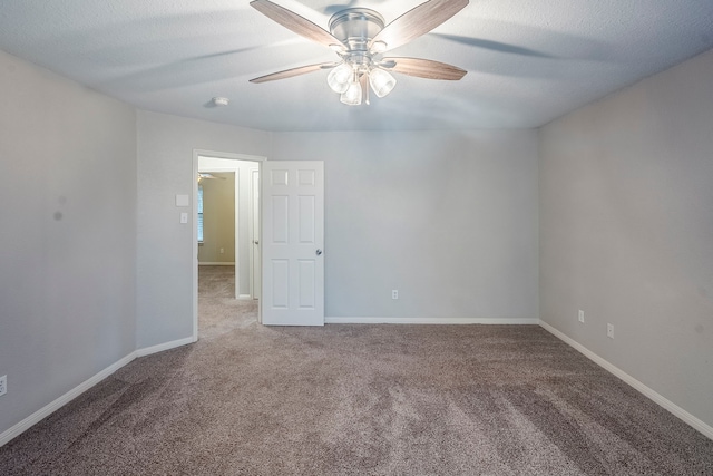 21106 Scenic Bluff Ln, Humble, TX 77338 - empty room featuring carpet, a ceiling fan, and baseboards