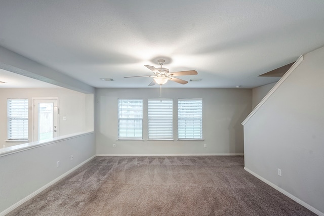 21106 Scenic Bluff Ln, Humble, TX 77338 - spare room featuring carpet floors, a ceiling fan, and baseboards