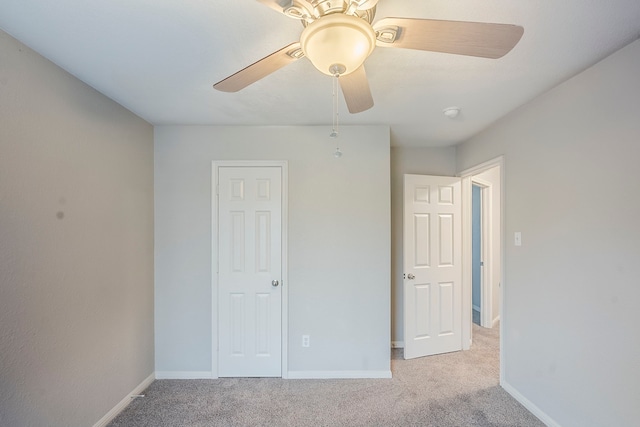 21106 Scenic Bluff Ln, Humble, TX 77338 - unfurnished bedroom featuring carpet, baseboards, and a ceiling fan
