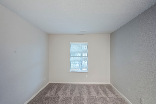 21106 Scenic Bluff Ln, Humble, TX 77338 - empty room featuring carpet flooring and baseboards