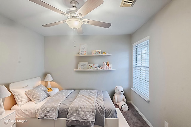 21106 Scenic Bluff Ln, Humble, TX 77338 - bedroom with carpet floors, baseboards, and a ceiling fan