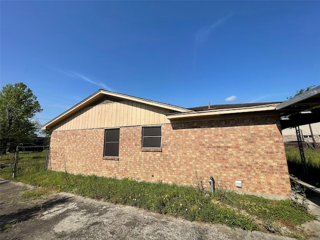 3225 Bostic St, Houston, TX 77093 - view of home's exterior featuring brick siding