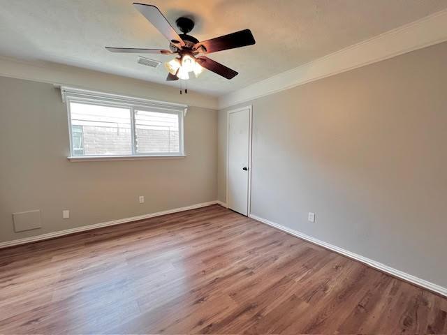 9015 Stone Brook Ln, Houston, TX 77040 - unfurnished room with a ceiling fan, wood finished floors, and baseboards