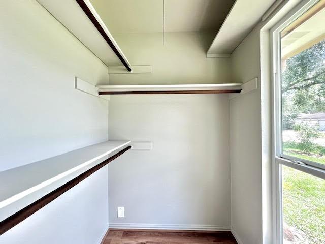 9015 Stone Brook Ln, Houston, TX 77040 - spacious closet featuring wood finished floors