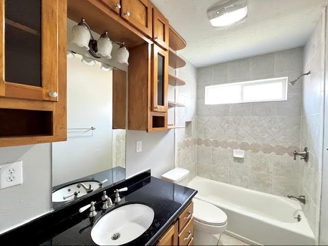 9015 Stone Brook Ln, Houston, TX 77040 - full bath featuring vanity,  shower combination, and toilet