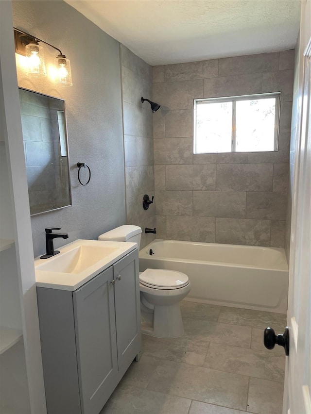 4115 Groton Dr, Houston, TX 77047 - full bathroom with vanity, toilet, shower / bath combination, and a textured wall