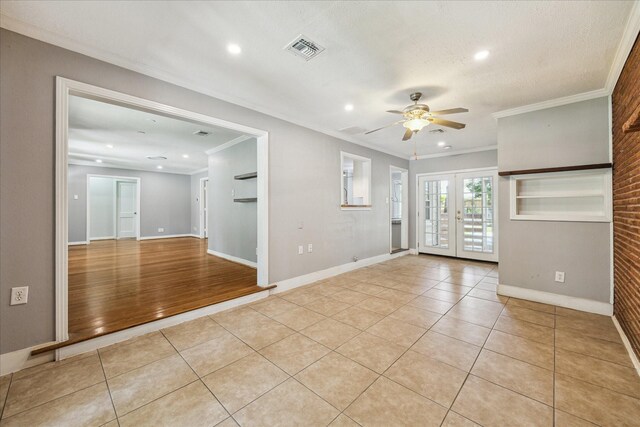 4301 Ascot Ln, Houston, TX 77092 - empty room featuring ceiling fan, light tile patterned floors, french doors, baseboards, and crown molding