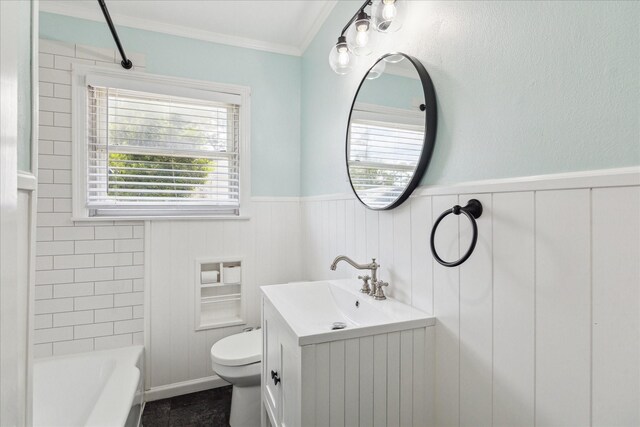 4301 Ascot Ln, Houston, TX 77092 - bathroom featuring vanity, toilet, wainscoting, healthy amount of natural light, and ornamental molding