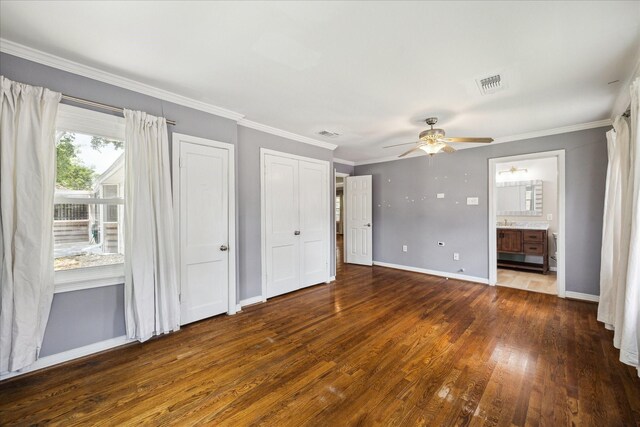 4301 Ascot Ln, Houston, TX 77092 - unfurnished bedroom featuring wood finished floors, baseboards, ornamental molding, ensuite bathroom, and ceiling fan