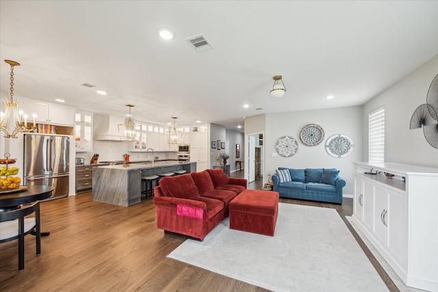 29303 Kellys Falls Ct, Katy, TX 77494 - living room with a chandelier, recessed lighting, dark wood finished floors, and healthy amount of natural light