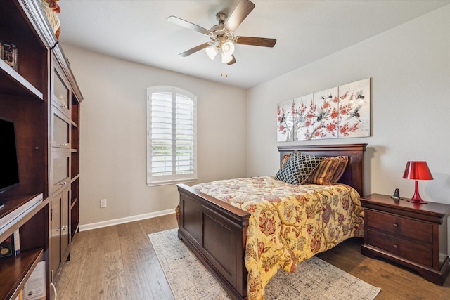 29303 Kellys Falls Ct, Katy, TX 77494 - bedroom with wood finished floors, baseboards, and ceiling fan