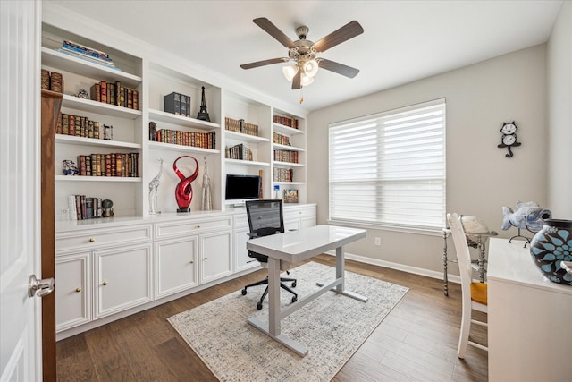 29303 Kellys Falls Ct, Katy, TX 77494 - home office featuring a ceiling fan, dark wood-style flooring, and baseboards
