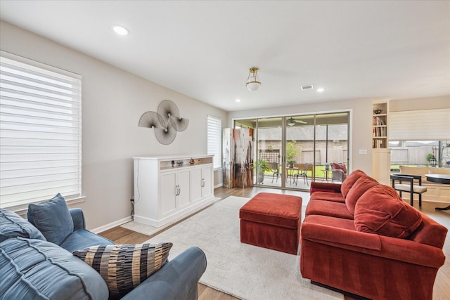29303 Kellys Falls Ct, Katy, TX 77494 - living room featuring light wood-type flooring, recessed lighting, and baseboards