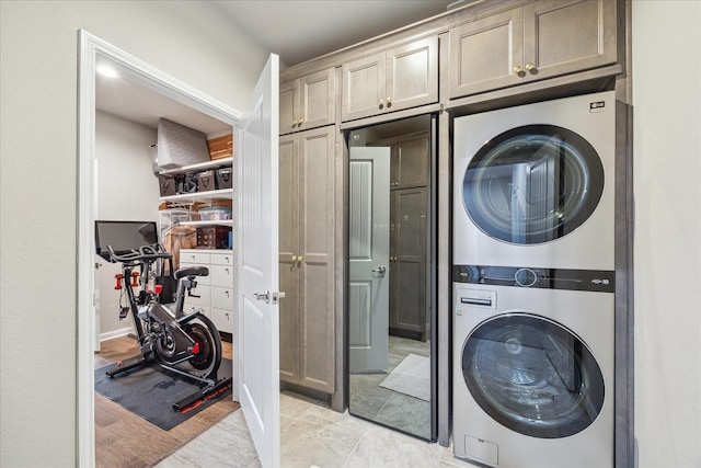 29303 Kellys Falls Ct, Katy, TX 77494 - laundry room with estacked washer and dryer and cabinet space
