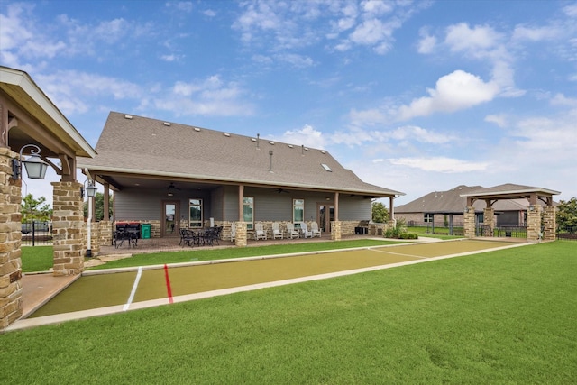 29303 Kellys Falls Ct, Katy, TX 77494 - rear view of property with a ceiling fan, a gazebo, a patio area, a shingled roof, and stone siding