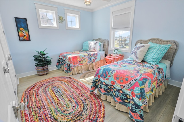 23125 Gulf Dr, Galveston, TX 77554 - bedroom featuring ornamental molding and wood finished floors