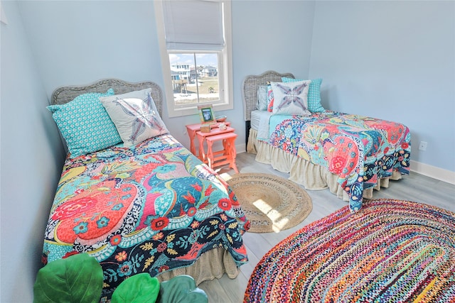 23125 Gulf Dr, Galveston, TX 77554 - bedroom with wood finished floors and baseboards