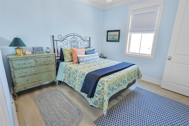 23125 Gulf Dr, Galveston, TX 77554 - bedroom with crown molding and wood finished floors
