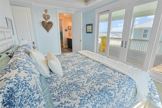 23125 Gulf Dr, Galveston, TX 77554 - bedroom featuring access to exterior, crown molding, a water view, and ensuite bathroom