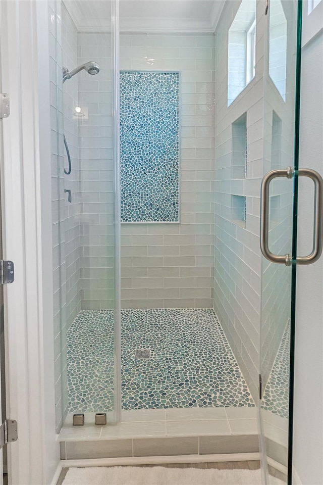 23125 Gulf Dr, Galveston, TX 77554 - bathroom featuring crown molding and a shower stall