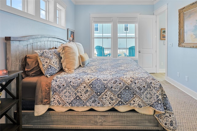 23125 Gulf Dr, Galveston, TX 77554 - bedroom with crown molding, multiple windows, and wood finished floors