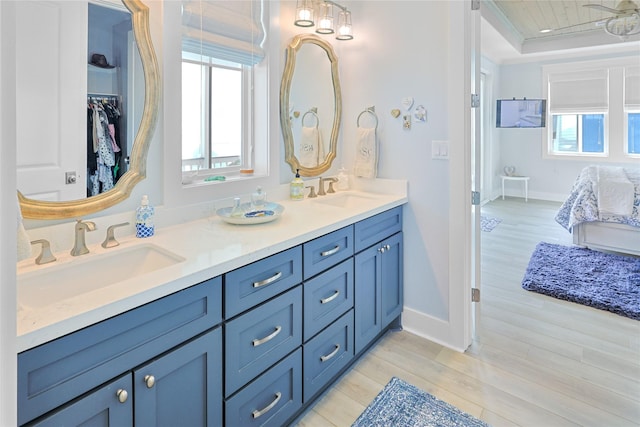 23125 Gulf Dr, Galveston, TX 77554 - bathroom with double vanity and wood finished floors