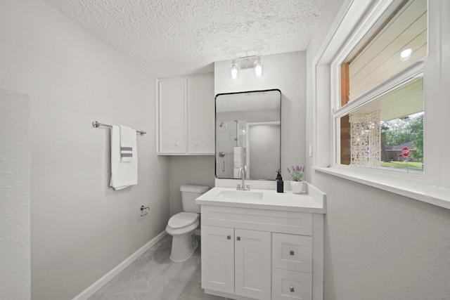 5347 Laurel Creek Way, Houston, TX 77017 - full bath with baseboards, vanity, toilet, a textured ceiling, and a shower