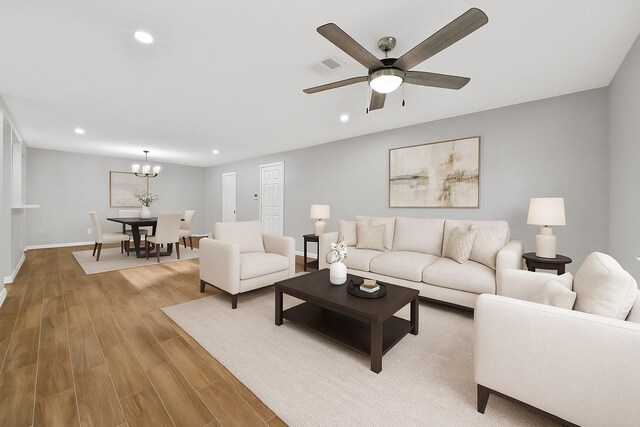 5347 Laurel Creek Way, Houston, TX 77017 - living room with recessed lighting, wood finished floors, ceiling fan, baseboards, and a chandelier