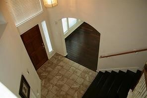 19734 Logan Briar Dr, Tomball, TX 77375 - foyer featuring stairway and arched walkways