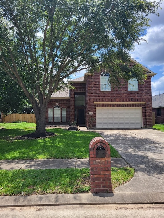 19734 Logan Briar Dr, Tomball, TX 77375 - traditional home featuring a garage, concrete driveway, and brick siding