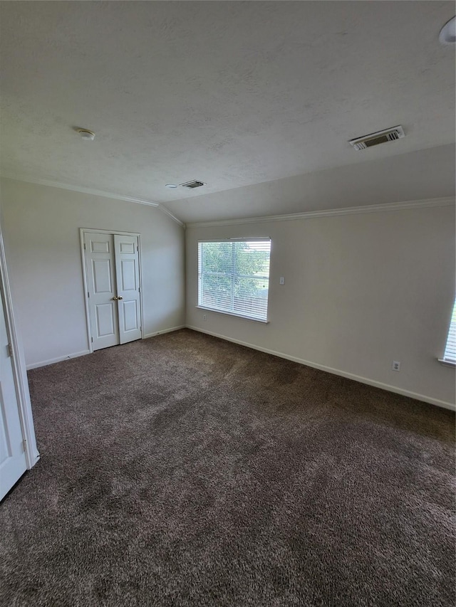 19734 Logan Briar Dr, Tomball, TX 77375 - empty room featuring ornamental molding, carpet floors, baseboards, and lofted ceiling