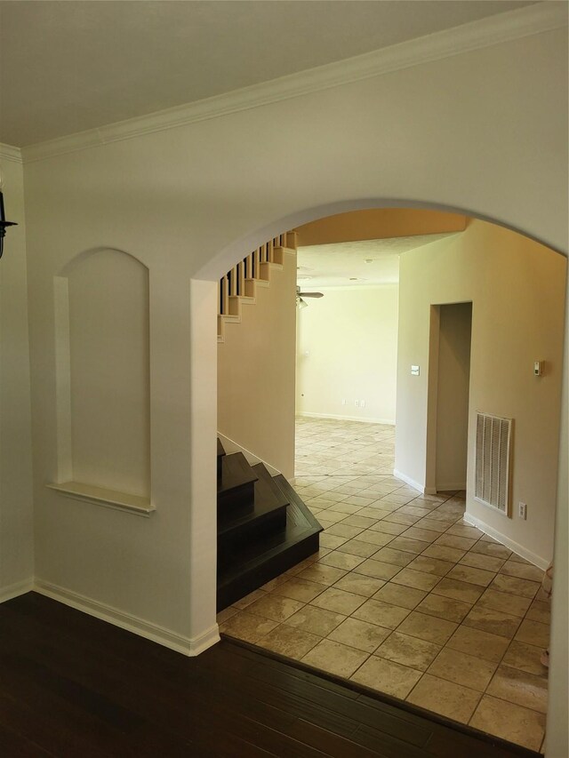 19734 Logan Briar Dr, Tomball, TX 77375 - corridor with arched walkways, crown molding, baseboards, and stairs