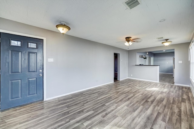 1507 Laird St, Houston, TX 77008 - unfurnished living room with wood finished floors, baseboards, and ceiling fan