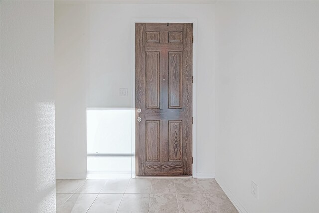 7106 Escondido Dr, Rosharon, TX 77583 - hallway with baseboards and tile patterned flooring