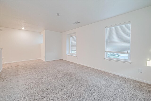 7106 Escondido Dr, Rosharon, TX 77583 - spare room featuring light carpet and baseboards