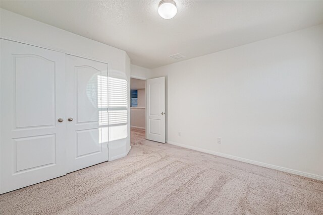 7106 Escondido Dr, Rosharon, TX 77583 - unfurnished bedroom with carpet floors, a closet, and baseboards
