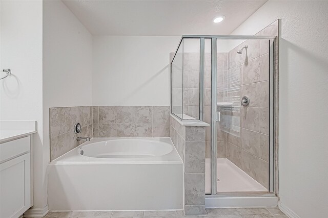 7106 Escondido Dr, Rosharon, TX 77583 - full bathroom with a bath, a shower stall, vanity, and tile patterned floors