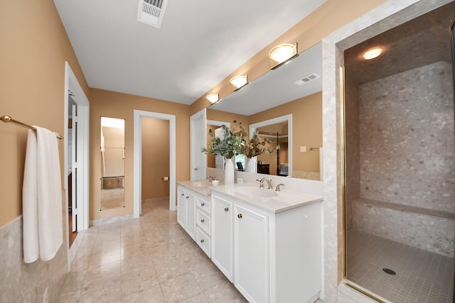 3820 Purdue St, Houston, TX 77005 - bathroom with double vanity, tile patterned floors, a stall shower, and a spacious closet