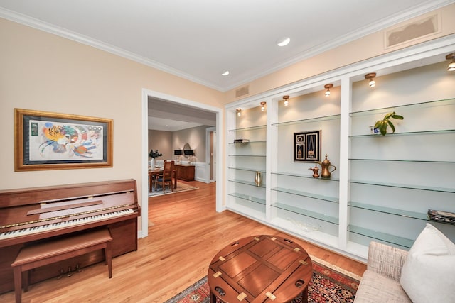 3820 Purdue St, Houston, TX 77005 - living area with ornamental molding, light wood-type flooring, recessed lighting, and built in shelves