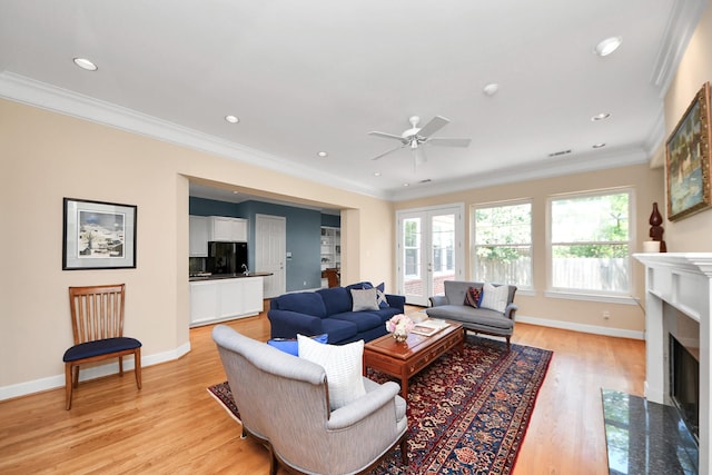 3820 Purdue St, Houston, TX 77005 - living room featuring plenty of natural light, ceiling fan, a fireplace with flush hearth, ornamental molding, and light wood-type flooring