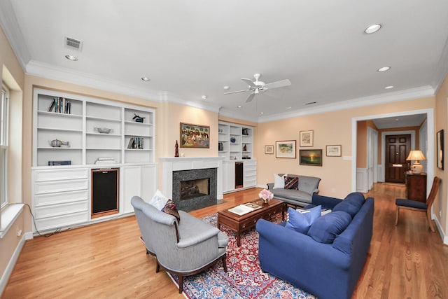 3820 Purdue St, Houston, TX 77005 - living area featuring ceiling fan, light wood-type flooring, recessed lighting, a premium fireplace, and crown molding