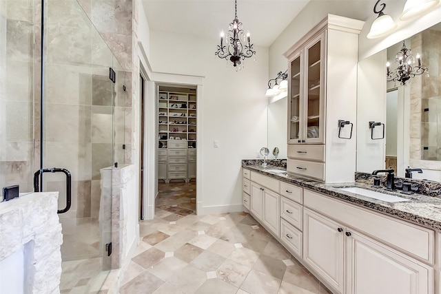 8305 Will Jordan Pkwy, Bellaire, TX 77401 - full bath featuring a chandelier, double vanity, a spacious closet, and a stall shower