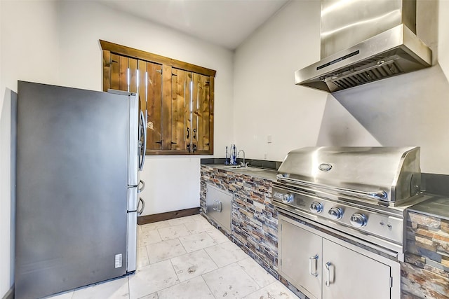 8305 Will Jordan Pkwy, Bellaire, TX 77401 - kitchen featuring freestanding refrigerator, wall chimney exhaust hood, and dark countertops