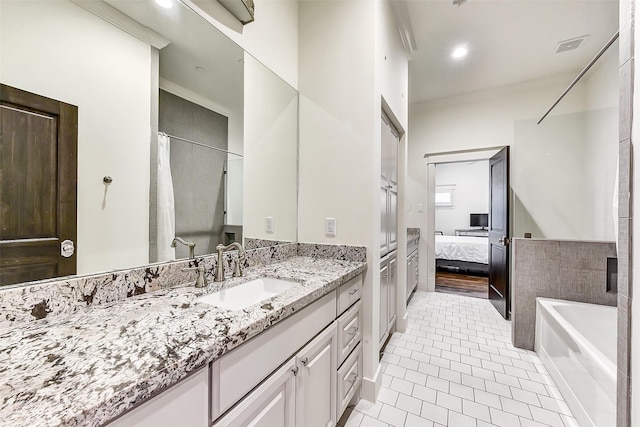 8305 Will Jordan Pkwy, Bellaire, TX 77401 - bathroom featuring vanity, connected bathroom, a tub, tile patterned flooring, and curtained shower